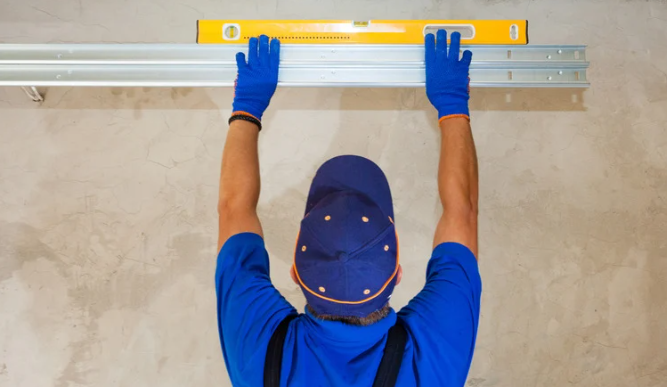 expert servicing a garage door