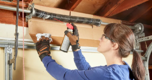 girl changing garage door springs