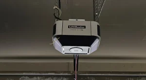 A direct, front-facing view of a ceiling-mounted LiftMaster smart garage door opener frames the motor housing central to What Does a Garage Door Opener Clicking Noise Usually Mean