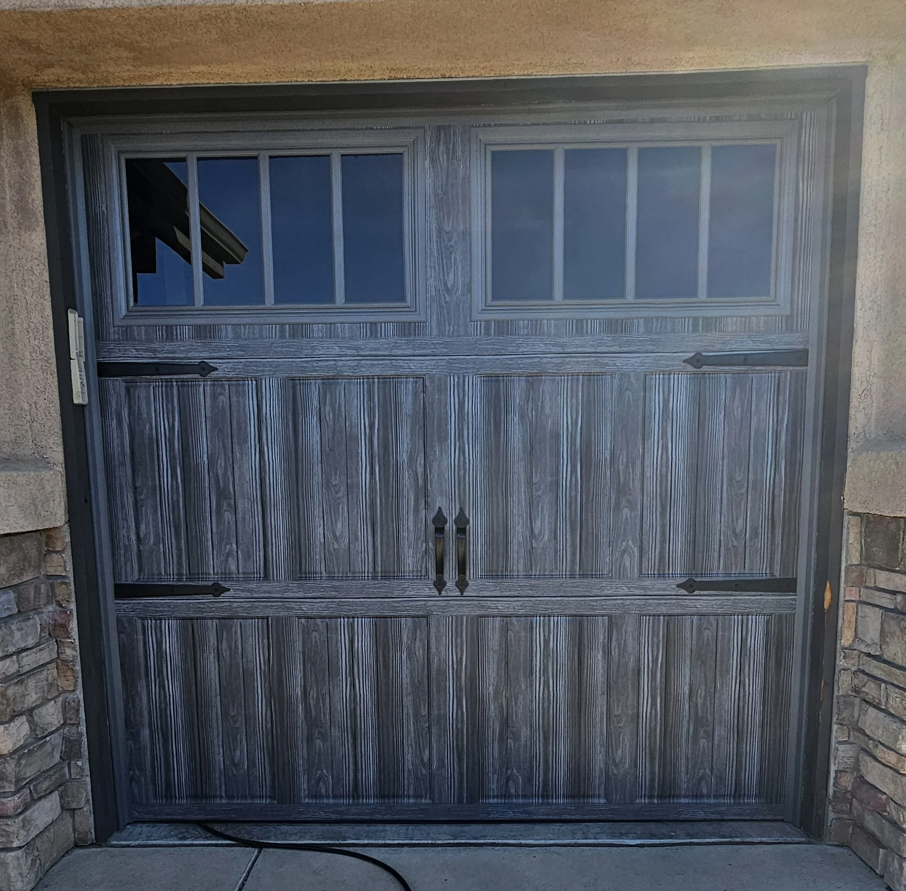 beautiful wood-look, carriage-style door featured in Can Garage Door Security Features Lower Home Insurance
