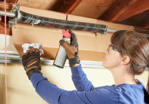 girl changing garage door springs